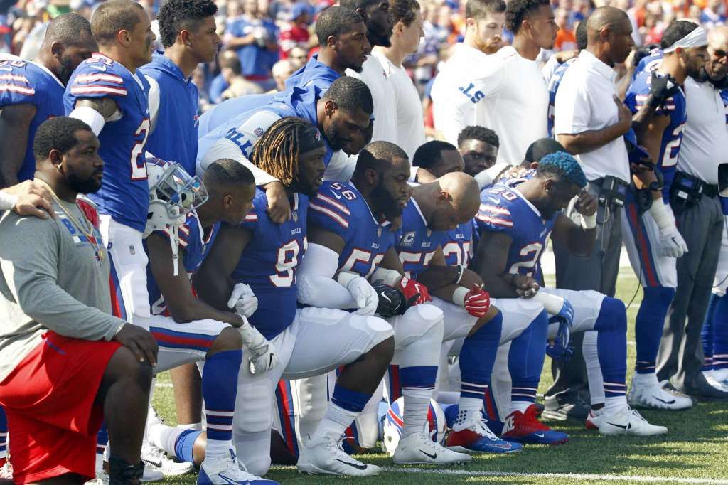 Former Texas A&M receiver Mike Evans sits during national anthem to protest  Donald Trump's win